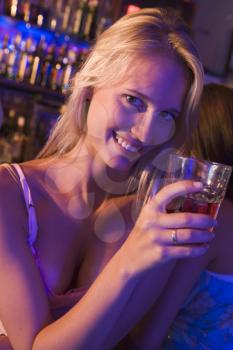 Royalty Free Photo of a Young Woman in a Bar