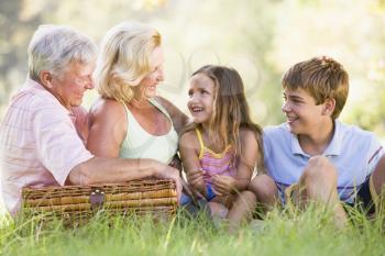 Royalty Free Photo of Grandparents Having a Picnic With Their Grandchildren