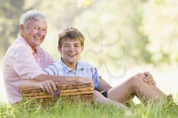 Royalty Free Photo of a Grandfather and Grandson With a Picnic Basket