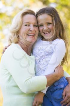 Royalty Free Photo of a Woman Hugging Her Granddaughter