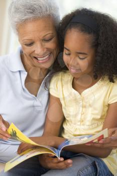 Royalty Free Photo of a Grandmother and Granddaughter Reading