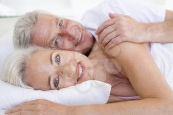 Royalty Free Photo of a Couple Lying in Bed
