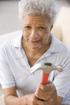 Royalty Free Photo of a Woman Holding a Hammer