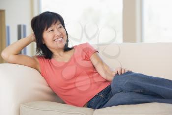 Royalty Free Photo of a Woman on a Couch
