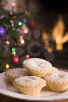 Royalty Free Photo of Mince Pies With a Fire and Christmas Tree in the Background