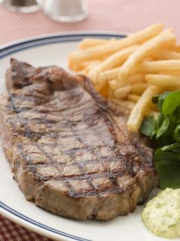 Royalty Free Photo of Steak Frite with Watercress and Barnaise Sauce