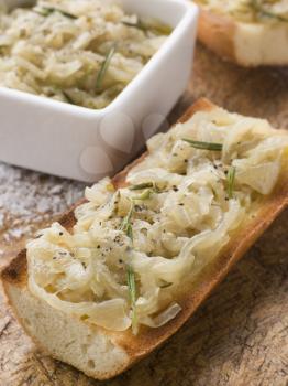 Royalty Free Photo of Confit of Onions on Toasted Baguette