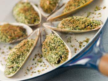 Royalty Free Photo of a Green Lip Mussel with a Provencale Herb Crust