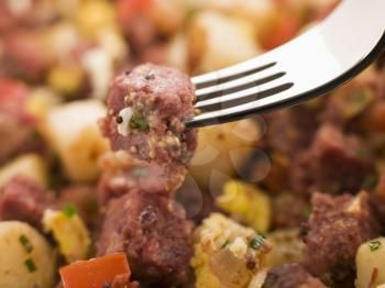 Royalty Free Photo of Corned Beef Hash on a Fork