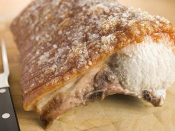 Royalty Free Photo of a Roast Loin of British Pork With Crackling
