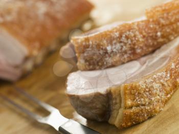 Royalty Free Photo of Roast Loin of Pork with Crispy Crackling