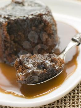 Royalty Free Photo of Sticky Toffee Pudding with Toffee Sauce