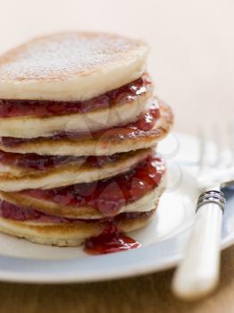 Royalty Free Photo of Pancakes with Strawberry Jam