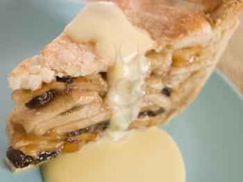 Royalty Free Photo of a Slice of Apple Pie and Custard
