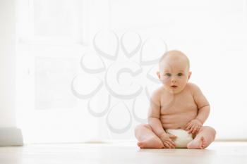 Royalty Free Photo of a Baby on the Floor