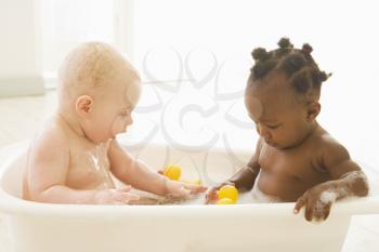 Royalty Free Photo of Two Babies in a Bubble Bath