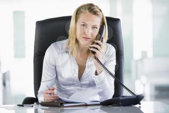 Royalty Free Photo of a Woman With a Datebook Talking on a Phone