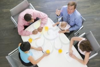 Royalty Free Photo of a People in a Boardroom With a Baby