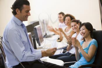 Royalty Free Photo of a Students Applauding a Teacher