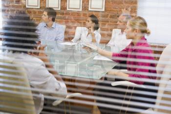 Royalty Free Photo Looking at Five People in a Boardroom Through a Window