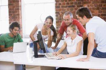 Royalty Free Photo of Five People Looking at a Computer