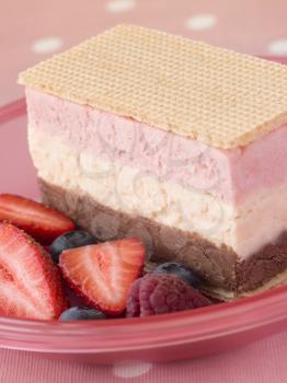 Royalty Free Photo fo Neapolitan Ice Cream With Wafer Biscuits and Berries