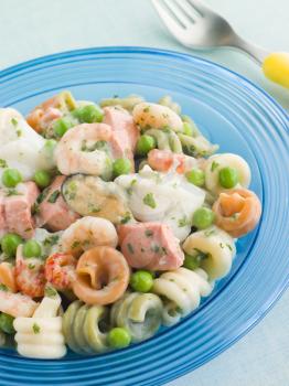 Royalty Free Photo of Seafood Pasta Spirals with Peas and Herbs