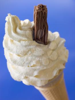 Royalty Free Photo of a Whipped Ice Cream Cone With a Chocolate Flake