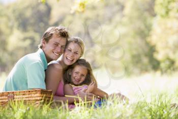 Royalty Free Photo of a Family With a Picnic Basket