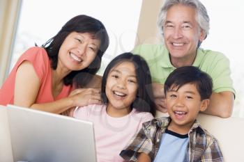 Royalty Free Photo of a Family With a Laptop