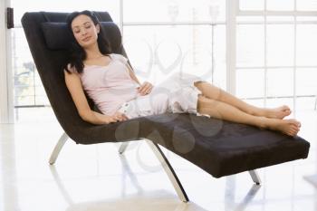 Royalty Free Photo of a Woman Sleeping in a Chair
