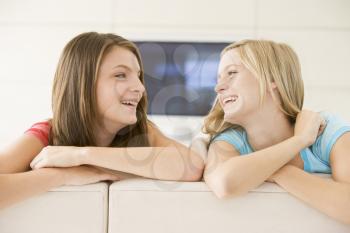 Royalty Free Photo of Two Girls on a Sofa