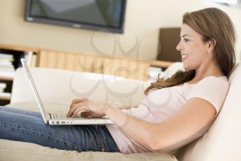 Royalty Free Photo of a Woman at Home With a Laptop