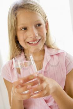 Royalty Free Photo of a Girl With a Glass of Water