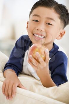 Royalty Free Photo of a Boy Eating an Apple