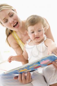 Royalty Free Photo of a Mother and Baby Reading