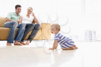 Royalty Free Photo of a Couple and Baby at Home