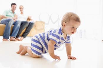 Royalty Free Photo of a Couple at Baby at Home