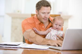 Royalty Free Photo of a Father and Child at a Laptop