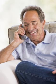 Royalty Free Photo of a Man Using a Telephone