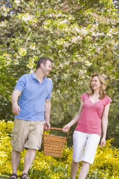 Royalty Free Photo of a Couple With a Picnic Basket