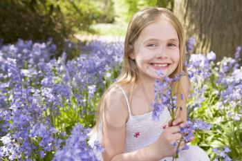 Royalty Free Photo of a Girl With Flowers
