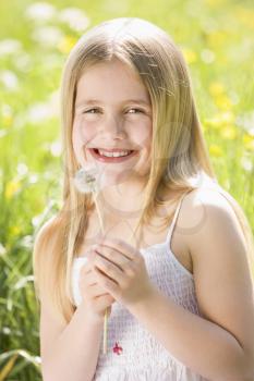 Royalty Free Photo of a Little Girl With a Dandelion