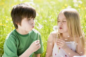 Royalty Free Photo of Children With Dandelions