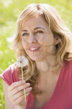 Royalty Free Photo of a Woman With a Dandelion