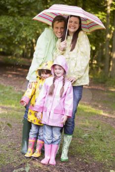 Royalty Free Photo of a Family in the Rain