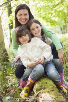 Royalty Free Photo of a Mother and Daughters in the Woods