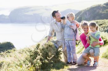 Royalty Free Photo of a Family on a Cliff