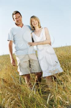 Royalty Free Photo of a Couple in a Field