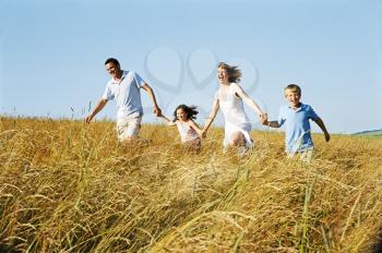 Royalty Free Photo of a Family Running